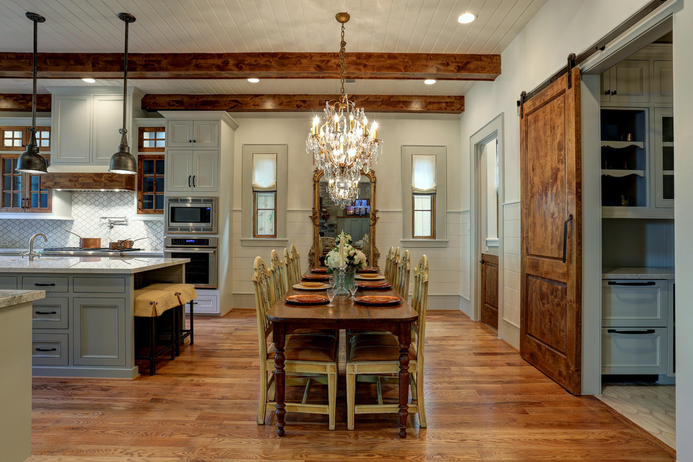 Example of a classic medium tone wood floor and brown floor great room design in Houston with beige walls
