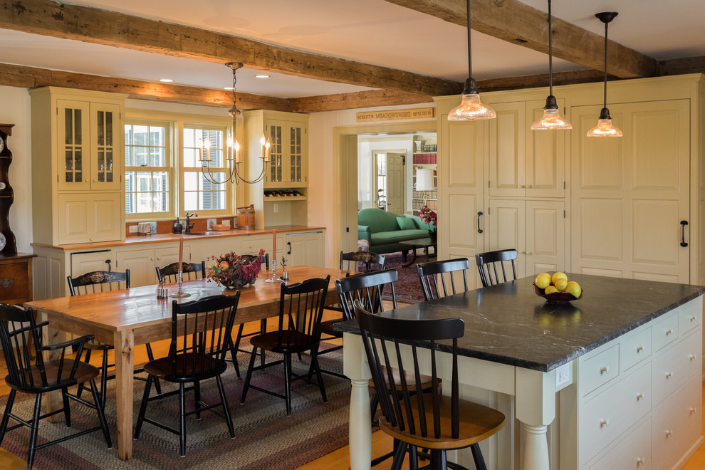 Photo of a large rural kitchen/dining room in Portland Maine with light hardwood flooring.