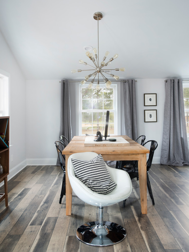 Inspiration for a small rural open plan dining room in Raleigh with white walls and laminate floors.