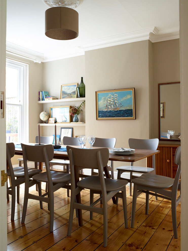 Enclosed dining room - coastal enclosed dining room idea in London