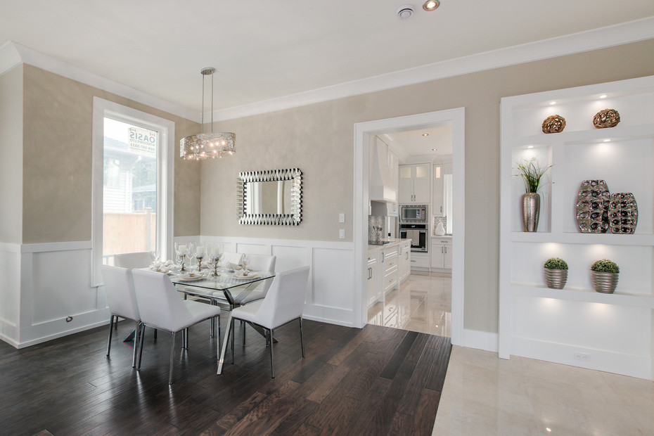 Photo of a medium sized classic open plan dining room in Vancouver with beige walls and dark hardwood flooring.