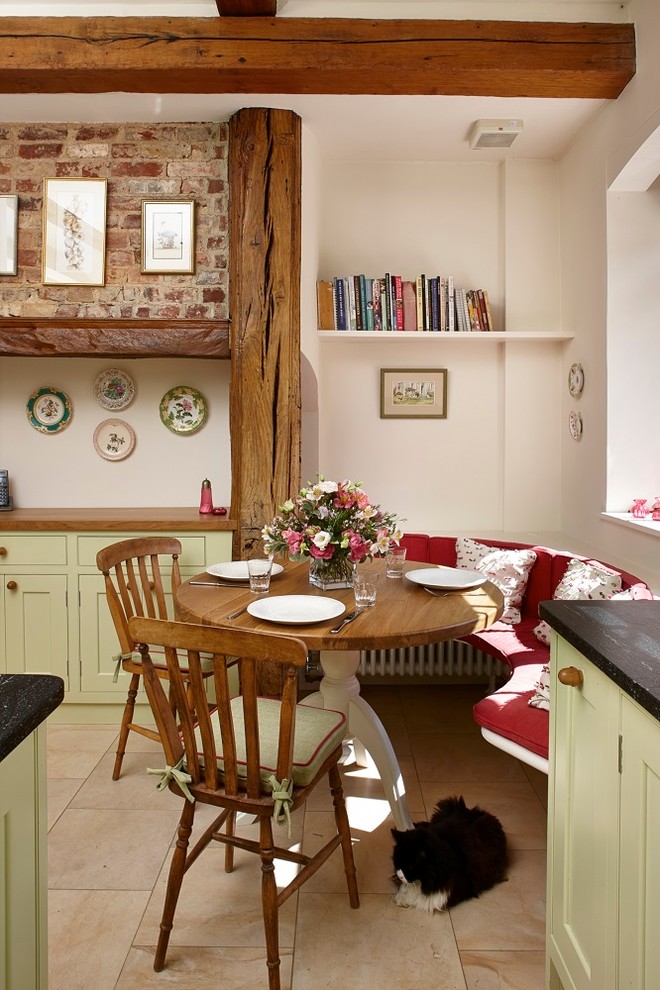 Kitchen/dining room combo - small country limestone floor kitchen/dining room combo idea in Surrey with beige walls