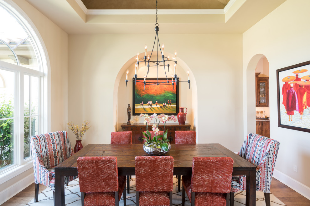 Inspiration for an expansive mediterranean enclosed dining room in Austin with beige walls and dark hardwood flooring.