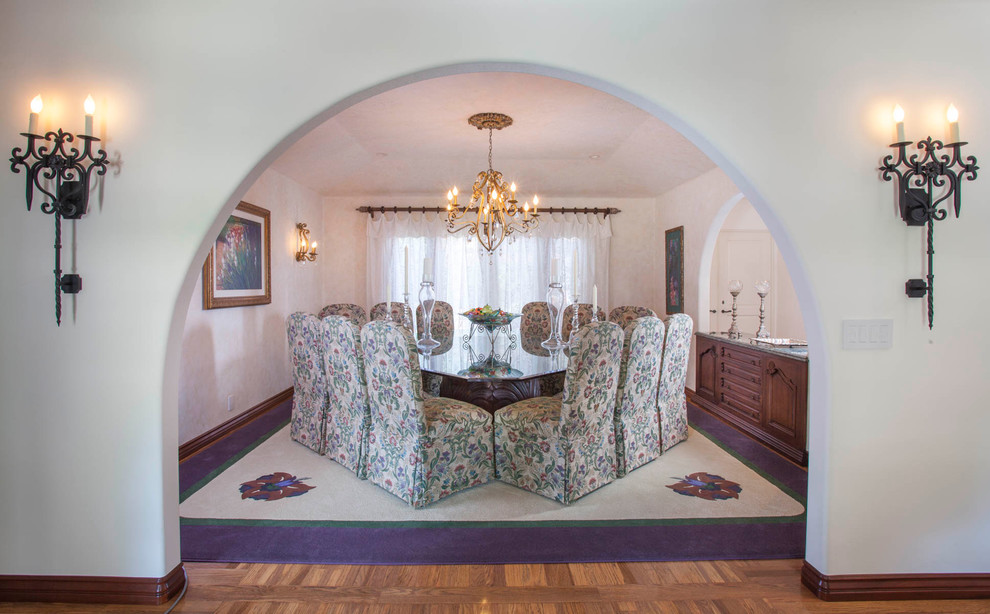 Photo of a large traditional dining room in San Diego with multi-coloured walls and medium hardwood flooring.
