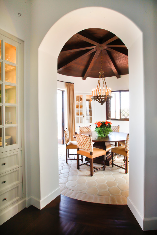 Mid-sized tuscan concrete floor and multicolored floor kitchen/dining room combo photo in Los Angeles
