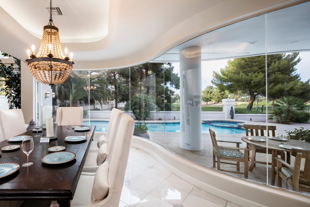 Inspiration for a transitional porcelain tile great room remodel in Los Angeles with beige walls and no fireplace