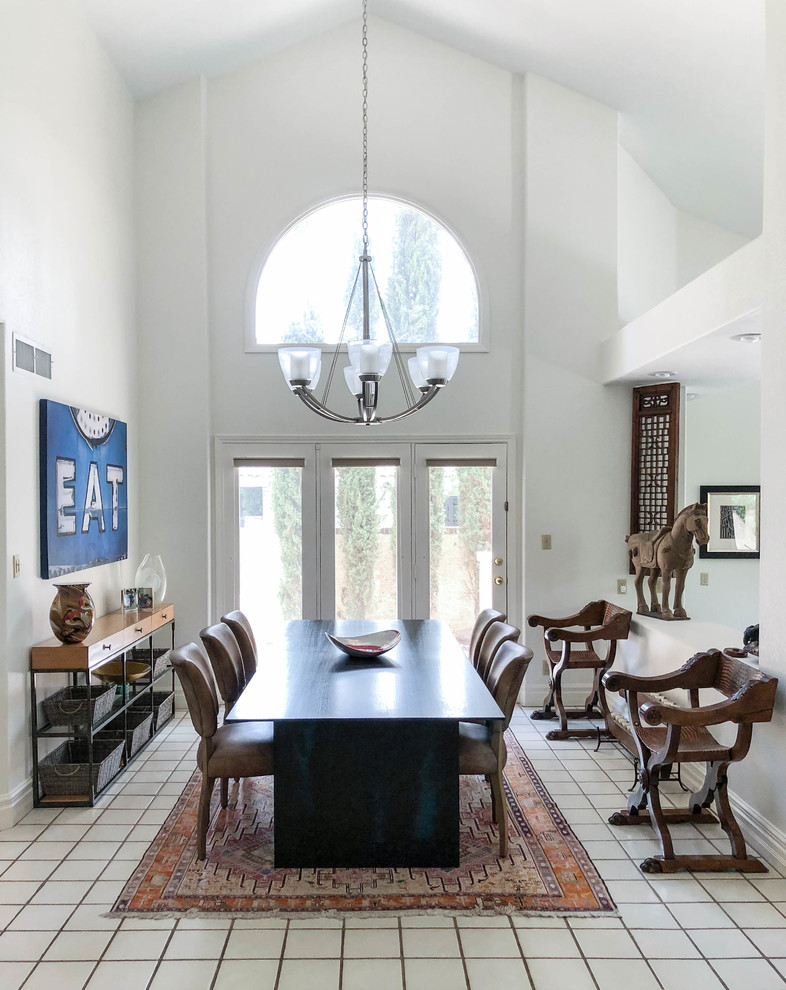 Eclectic white floor enclosed dining room photo in Las Vegas with white walls