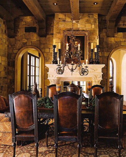 Photo of an expansive classic enclosed dining room in Phoenix with brown walls, travertine flooring, a two-sided fireplace and a stone fireplace surround.