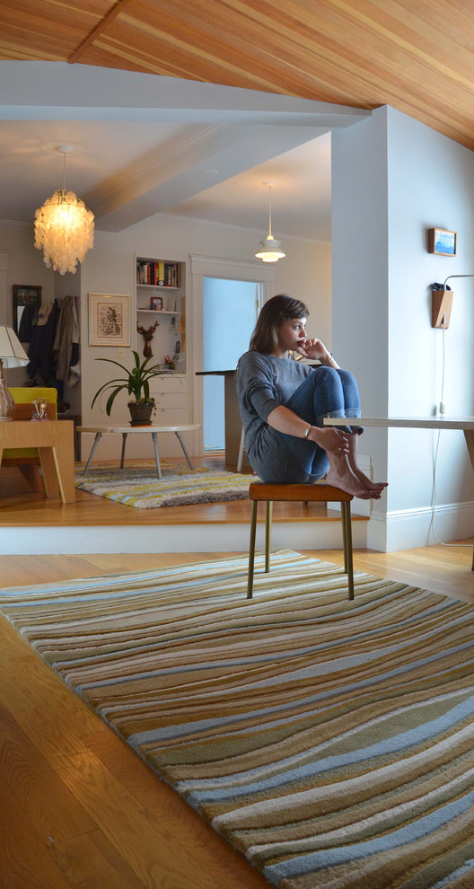 Eclectic dining room photo in Portland Maine with white walls