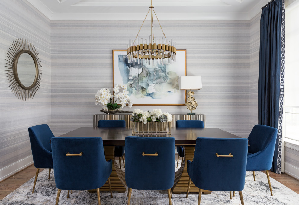 Inspiration for a transitional medium tone wood floor, brown floor, coffered ceiling and wallpaper enclosed dining room remodel in Houston with multicolored walls