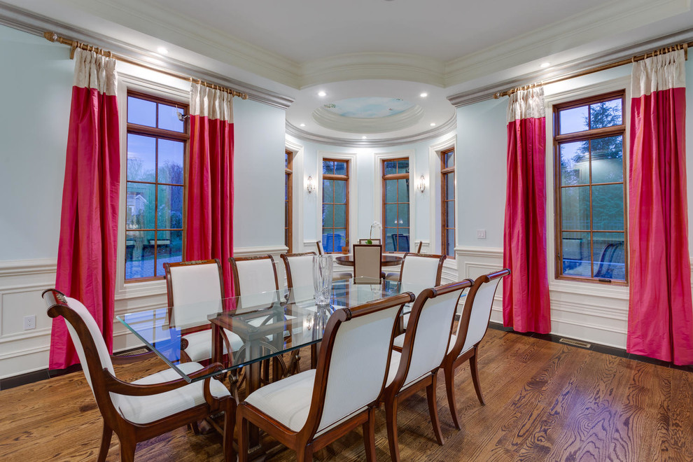 Enclosed dining room - large traditional medium tone wood floor enclosed dining room idea in DC Metro with blue walls