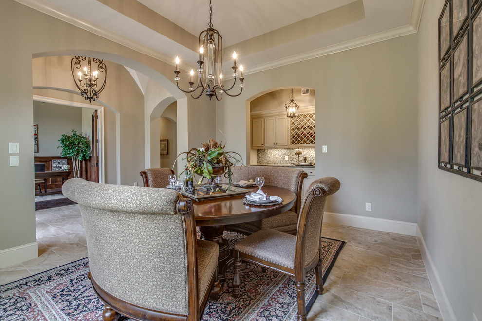 Inspiration for a large mediterranean enclosed dining room in Houston with beige walls, ceramic flooring, no fireplace and beige floors.