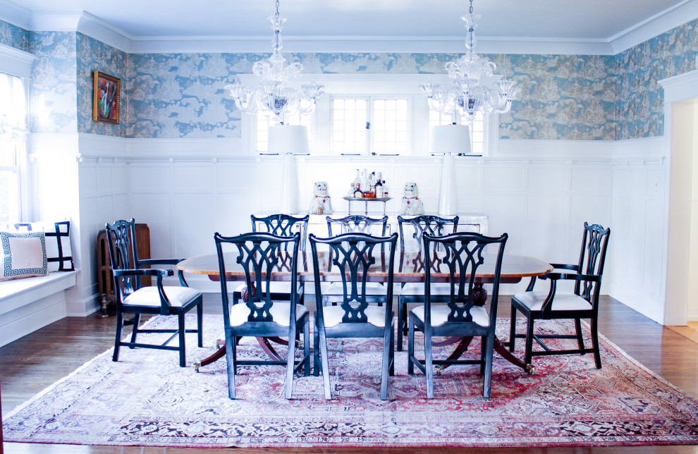 Photo of a large classic dining room with medium hardwood flooring.