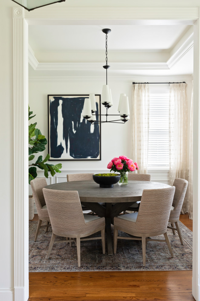 Inspiration for a small classic enclosed dining room in Orlando with white walls, medium hardwood flooring, brown floors and a drop ceiling.