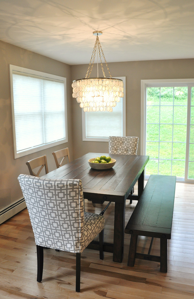 Example of a mid-sized transitional light wood floor kitchen/dining room combo design in Burlington with gray walls
