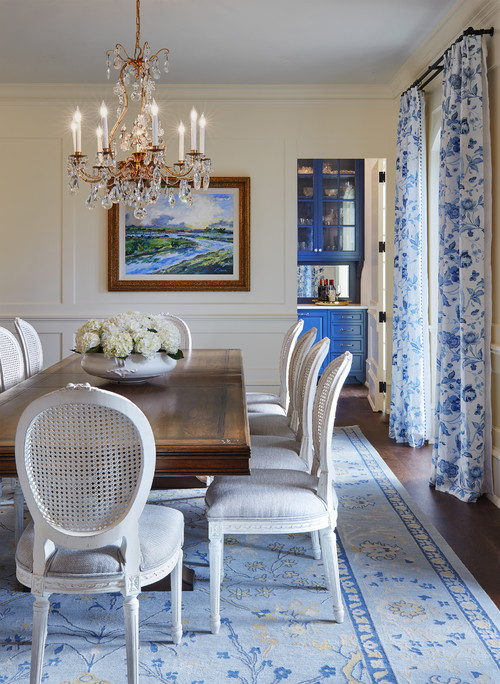 oval white chairs and dark wood table in traditional french formal dining room