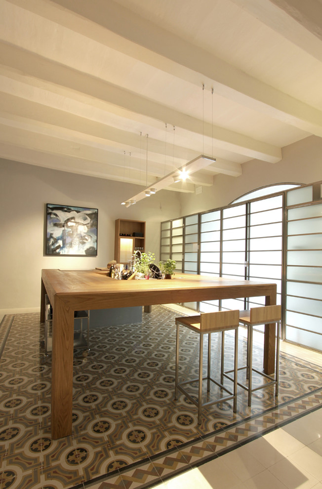 This is an example of a contemporary dining room in Other with grey walls.