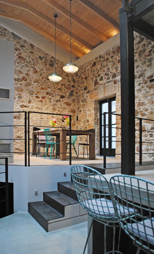 Enclosed dining room - industrial concrete floor enclosed dining room idea in Other