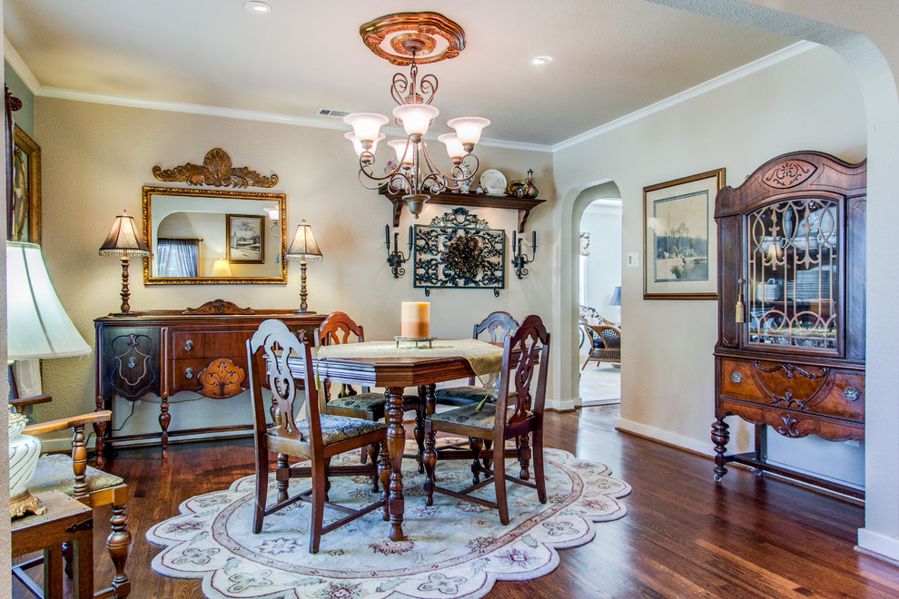 Photo of a classic dining room in Dallas with beige walls and dark hardwood flooring.