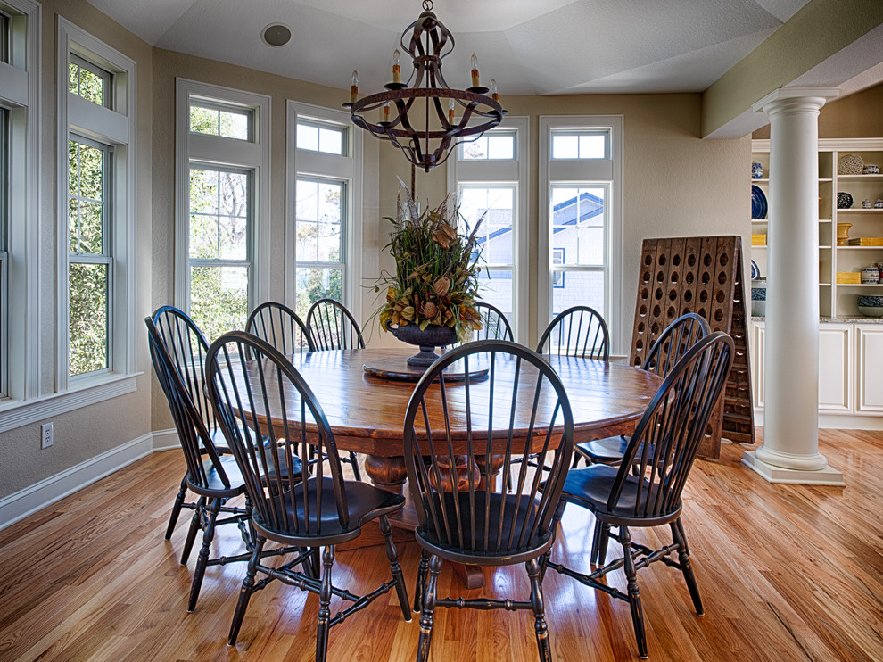 Large coastal dining room in Other with beige walls, medium hardwood flooring and no fireplace.