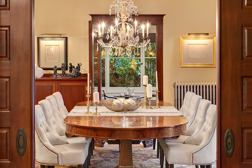 Expansive traditional enclosed dining room in Seattle with beige walls, light hardwood flooring and no fireplace.