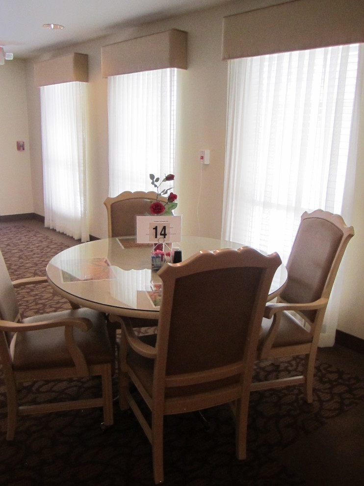 Large classic dining room in Las Vegas with beige walls and carpet.