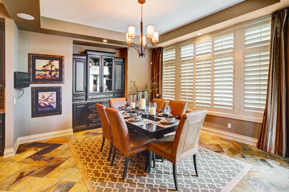 This is an example of a large classic kitchen/dining room in Calgary with brown walls, terracotta flooring and no fireplace.