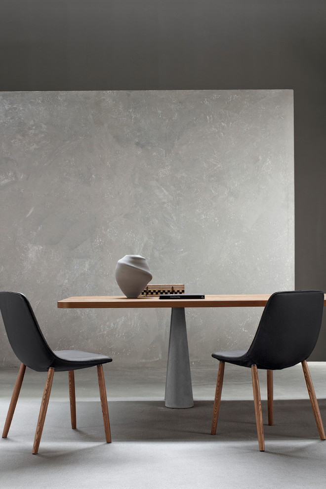 Ispirazione per una grande sala da pranzo aperta verso la cucina design con pareti grigie, pavimento in cemento e pavimento grigio