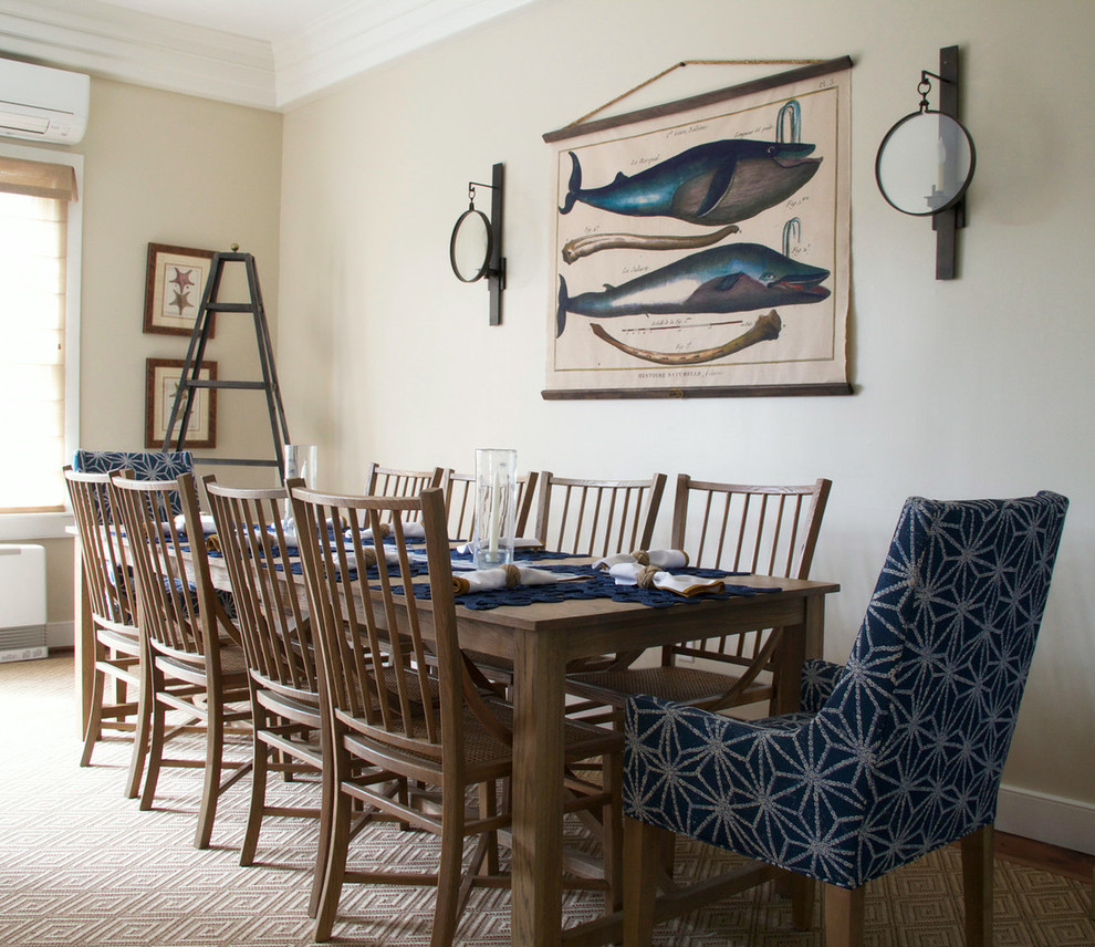 Inspiration for a coastal dining room in Boston with beige walls.
