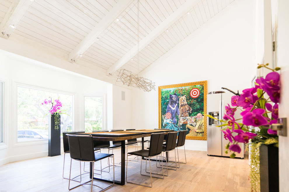 Example of a mid-sized trendy light wood floor dining room design in Los Angeles with white walls