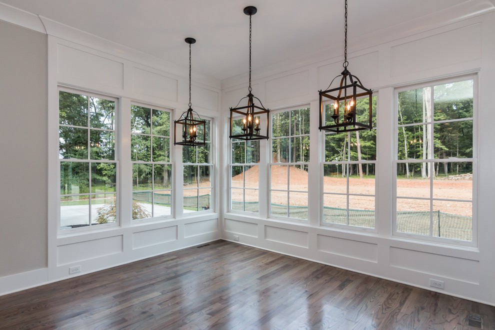 Inspiration for a large cottage medium tone wood floor kitchen/dining room combo remodel in Raleigh with white walls and no fireplace