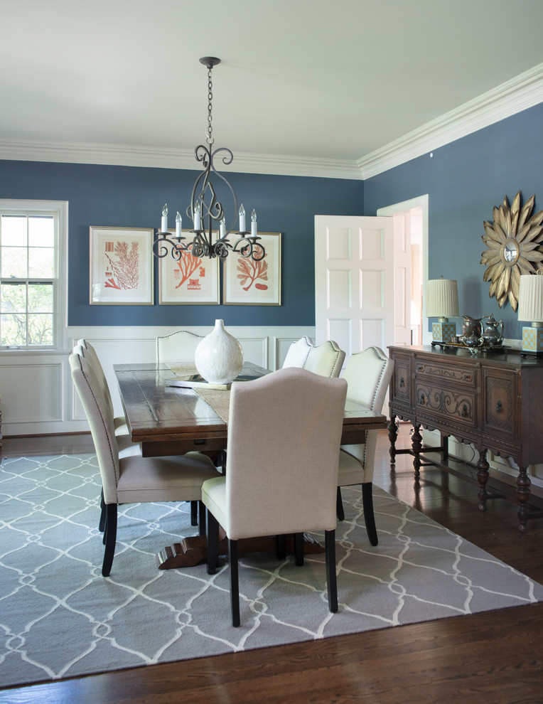 Design ideas for a large traditional enclosed dining room in Kansas City with blue walls, medium hardwood flooring and no fireplace.