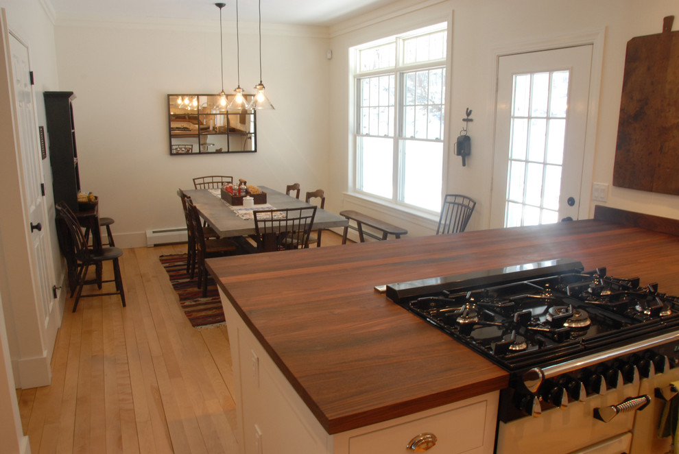 Inspiration for a small cottage light wood floor kitchen/dining room combo remodel in Burlington with white walls