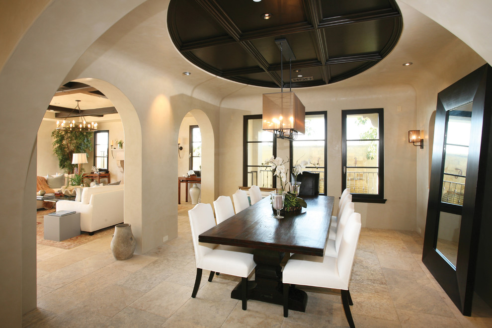 Mid-sized tuscan limestone floor and beige floor great room photo in Orange County with beige walls and no fireplace