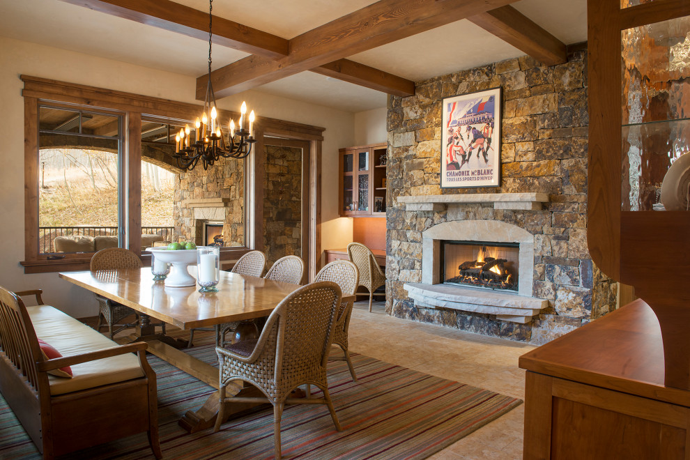 Inspiration for a mid-sized rustic beige floor enclosed dining room remodel in Denver with beige walls, a standard fireplace and a stone fireplace