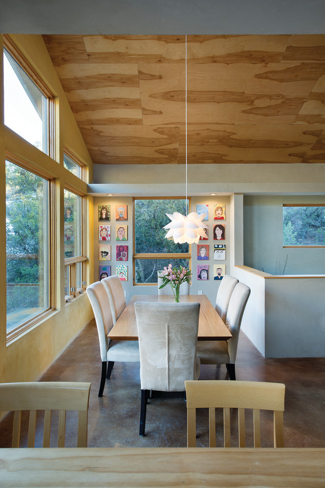 Contemporary dining room in Albuquerque with grey walls.
