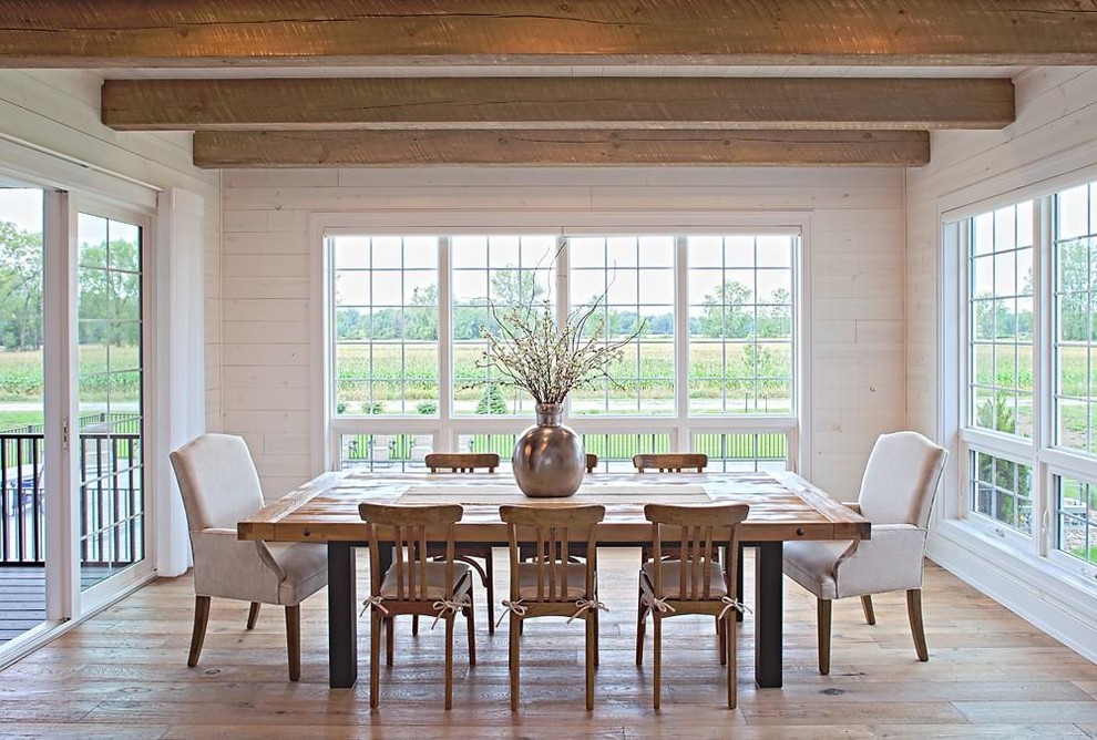 Photo of a medium sized rustic kitchen/dining room in Other with white walls, light hardwood flooring and no fireplace.