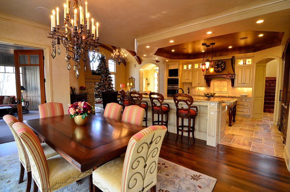 Example of a large classic dark wood floor kitchen/dining room combo design in Minneapolis with beige walls