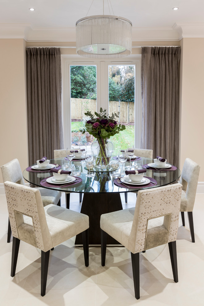 Inspiration for a transitional dining room remodel in Surrey with beige walls