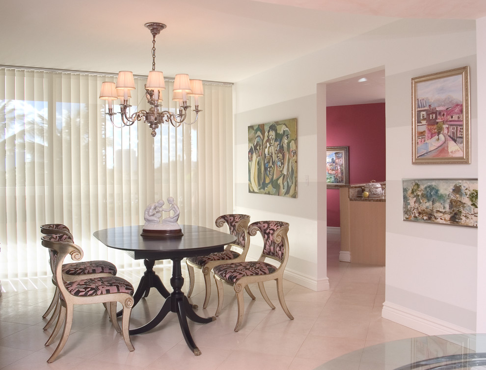 Medium sized eclectic enclosed dining room in Miami with white walls.