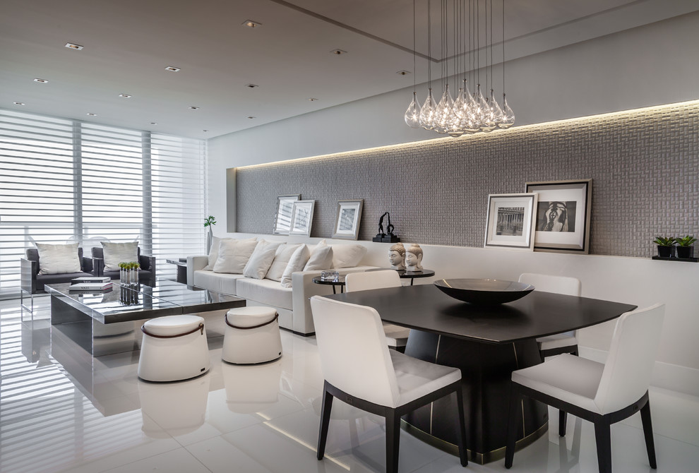 Photo of a medium sized contemporary open plan dining room in Miami with white walls, porcelain flooring, no fireplace and white floors.