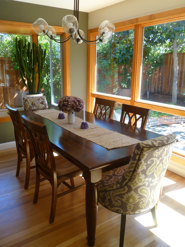 This is an example of a medium sized classic kitchen/dining room in San Francisco with grey walls and light hardwood flooring.