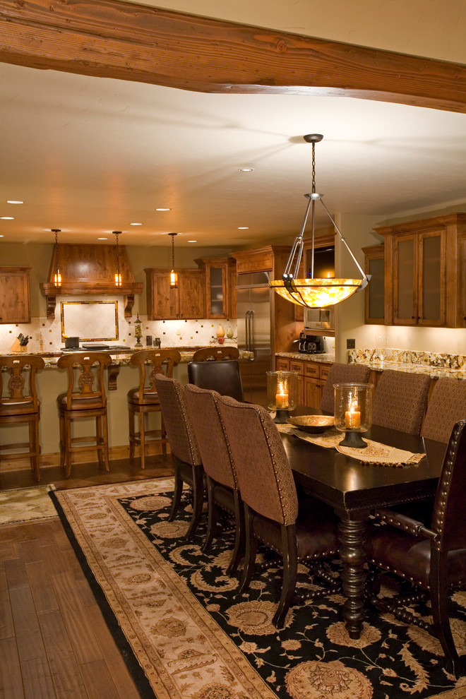 Example of a mid-sized mountain style medium tone wood floor kitchen/dining room combo design in Other with no fireplace
