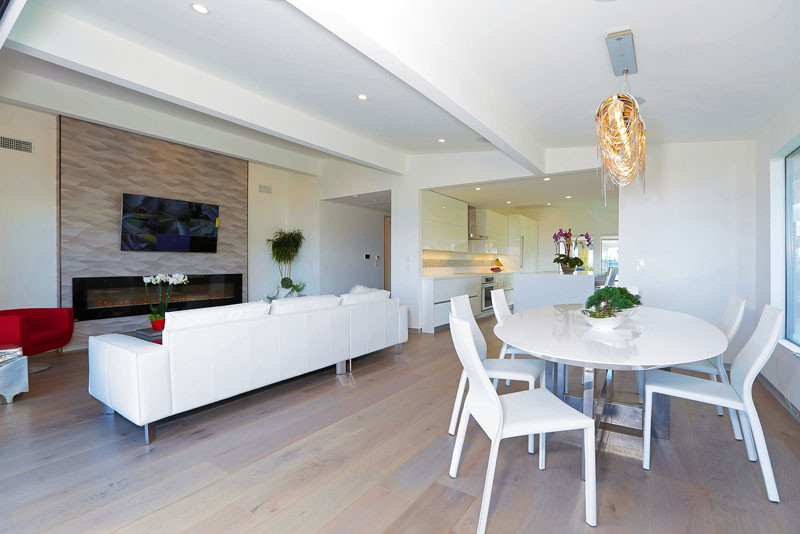 Inspiration for a medium sized modern open plan dining room in Los Angeles with white walls and light hardwood flooring.