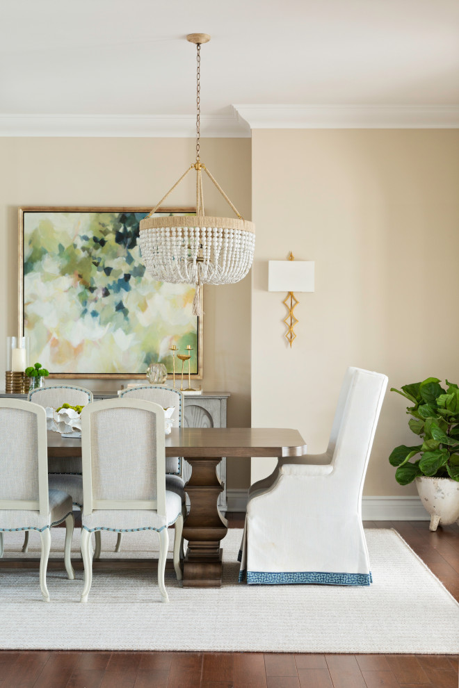 Design ideas for a large mediterranean open plan dining room in Tampa with beige walls and brown floors.