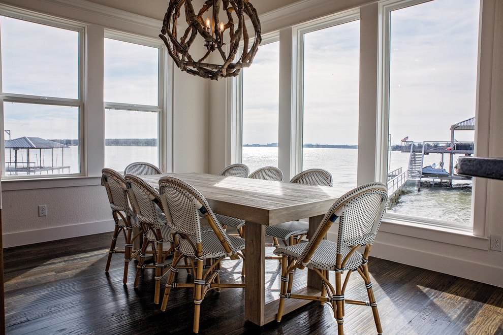Mid-sized beach style dark wood floor and brown floor great room photo in Dallas with white walls and no fireplace