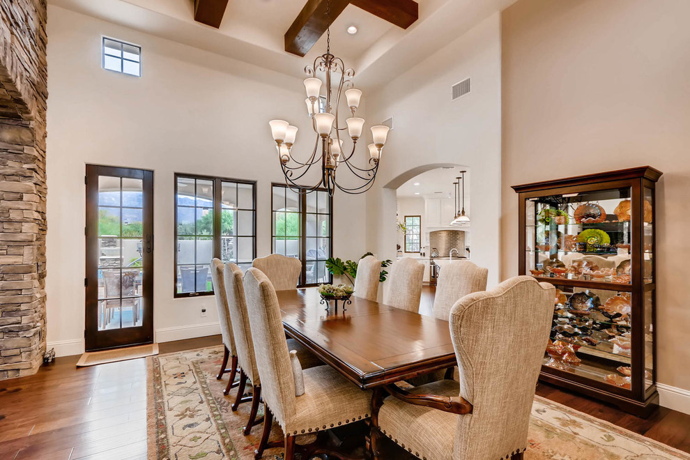 Inspiration for a classic open plan dining room in Phoenix with laminate floors and brown floors.