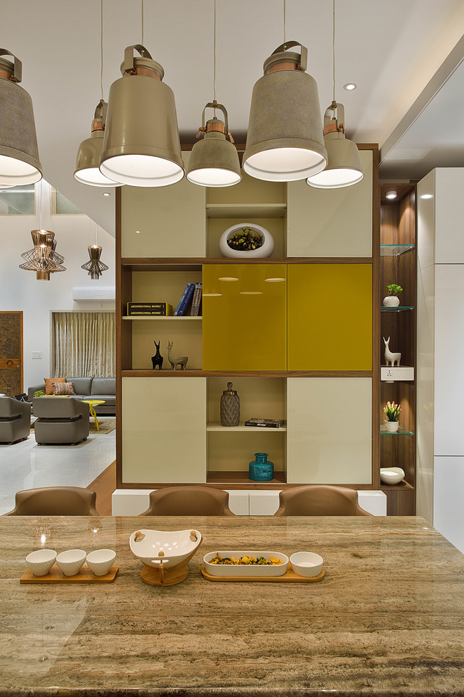 Inspiration for a contemporary dining room in Mumbai.