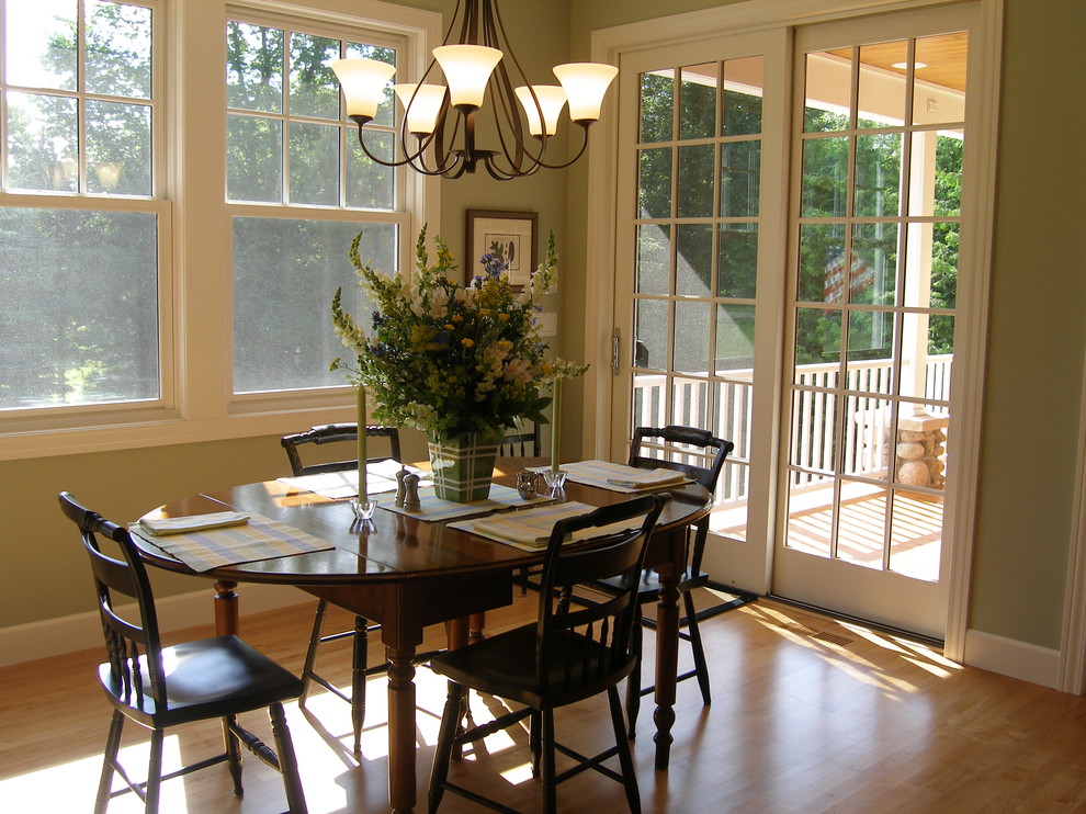 Photo of a small traditional open plan dining room in Other with green walls, light hardwood flooring and no fireplace.