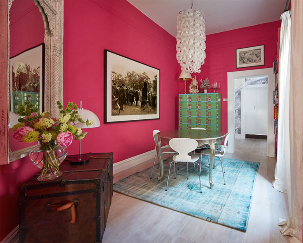 Dining room - dining room idea in New York with pink walls